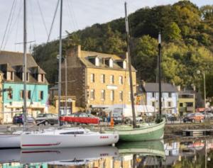 a group of boats are docked in a harbor at La Capitainerie Port du Légué in Plérin