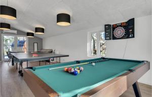 a billiard room with two pool tables and a dartboard at Stunning Home In Ebeltoft With Wifi in Ebeltoft +26 photos