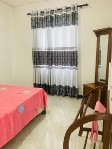 Ένα ή περισσότερα κρεβάτια σε δωμάτιο στο Rose Place
