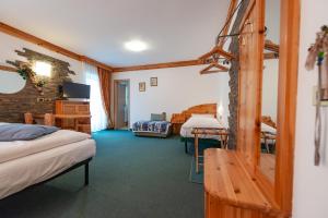 Postel nebo postele na pokoji v ubytování Hotel Ciamol