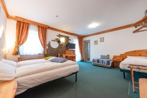Postel nebo postele na pokoji v ubytování Hotel Ciamol