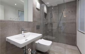 a bathroom with a sink and a shower and a toilet at Prince in Binz +38 photos