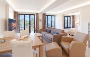 a living room with a couch and a table at Prince in Binz