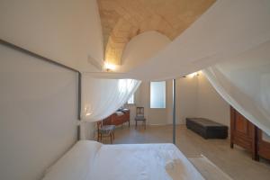 Ένα ή περισσότερα κρεβάτια σε δωμάτιο στο San Domenico Suite Cavallino