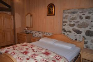 A bed or beds in a room at Baita Tomaselli