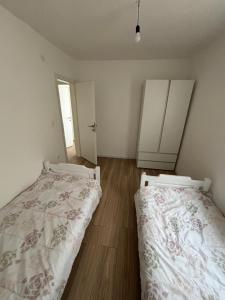 Postel nebo postele na pokoji v ubytování Apartman Perla