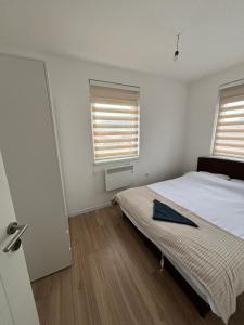 Postel nebo postele na pokoji v ubytování Apartman Perla