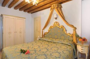 Postel nebo postele na pokoji v ubytování Hotel Al Vagon