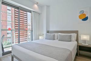 Postel nebo postele na pokoji v ubytování Lugaris Rambla Apartments