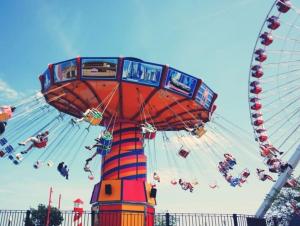 a ferris wheel with people on it at a carnival at Southampton Central Pad in Southampton