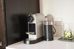 a coffee maker on a counter next to a blender at Amaliegade 10 B in Aarhus +8 photos