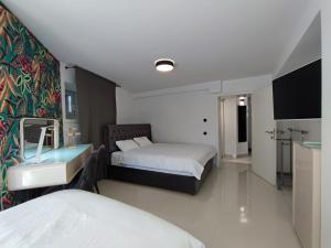 En eller flere senge i et værelse på Engradado Britanski trg