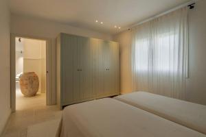 a bedroom with a bed and a cabinet in it at Casa Das Ferreñas in Melide +25 photos