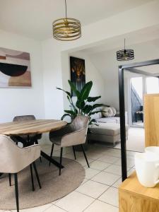 a living room with a table and a couch at Dom 007 in Fulda