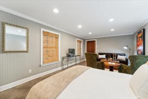 a bedroom with a bed and a living room at 308 W Taylor Street Garden in Savannah