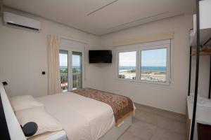 Posteľ alebo postele v izbe v ubytovaní Lighthouse Apartments