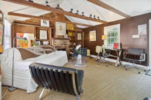 a living room with a white couch and a table at 16 E Jones Carriage House in Savannah