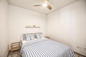 En eller flere senge i et værelse på Casa El Puerto by Huskalia