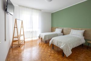 Postel nebo postele na pokoji v ubytování Casa Genny