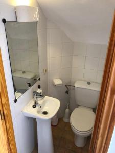 a small bathroom with a toilet and a sink at 2 Bedroom Townhouse - Mojacar - sleeps 4 - R018 in Mojácar +13 photos