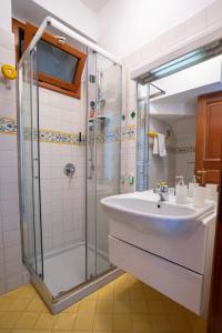 a bathroom with a sink and a shower at Villa Miramare, piscina e parcheggio a Conca dei Marini in Conca dei Marini