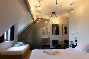 Una cama o camas en una habitación de 't Convent