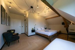 Una cama o camas en una habitación de 't Convent