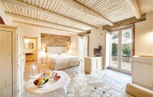 a bedroom with a bed and a table with fruit on it at Rupe Alta in Castellabate