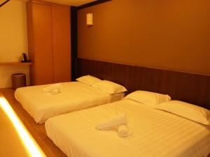 Postel nebo postele na pokoji v ubytování Hotel Vevo Puchong Malaysia