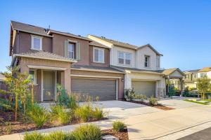 a house with a garage in a residential neighborhood at 8 Mi to Lincoln Park Family-Friendly Tracy Home in Tracy