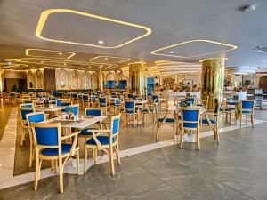 a dining room with tables and chairs in a restaurant at 2 BDR Suite in 5 Star Hotel in Rawai Beach