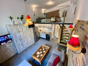 an overhead view of a living room with a couch and a tv at Sophia Loft Luxury Stay with Parking in Athens +13 photos