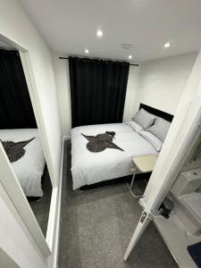 a small room with a bed and a window at London Kings Cross Room w Bath in London