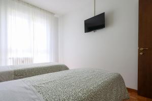 Postel nebo postele na pokoji v ubytování Casa Genny