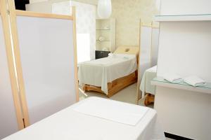 Posteľ alebo postele v izbe v ubytovaní Hotel Tami Residence