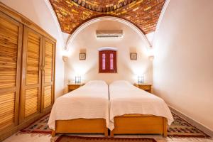 Postel nebo postele na pokoji v ubytování villa al diwan luxor + 37 fotografií