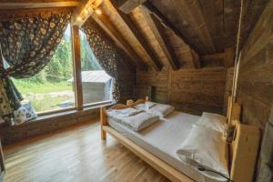 Posteľ alebo postele v izbe v ubytovaní Eirl DOLOMITES Retreat Sappada + 37 fotografií