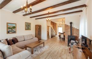 a living room with a couch and a fireplace at Amazing Home In Herceg Novi With Wifi in Herceg-Novi