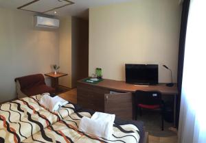 TV a/nebo společenská místnost v ubytování Penzion Toscana