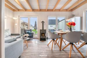 Posezení v ubytování Ferienhaus Huus Luv