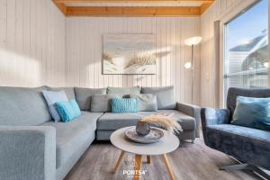 Posezení v ubytování Ferienhaus Huus Luv