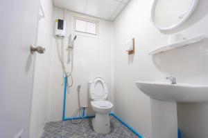 a bathroom with a toilet and a sink at เดอะกาญจน์รีสอร์ท- The Kan Resort in Ban Laem Mong Khoi +37 photos