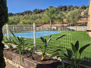 a fence around a swimming pool in a yard at Spacious Villa with Pool in Pruna, 140 m² in Pruna