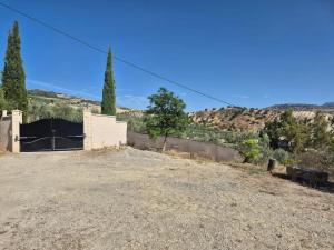 a house in the middle of a dirt road at Spacious Villa with Pool in Pruna, 140 m² in Pruna
