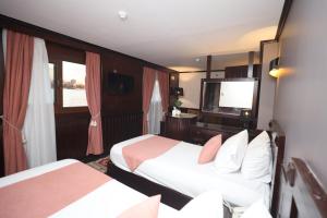 Voodi või voodid majutusasutuse YOU Nile View Hotel toas