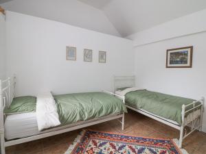 Postel nebo postele na pokoji v ubytování Bayside Cottage