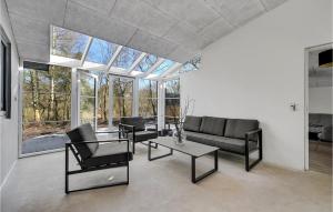 a living room with a couch and a table at Stunning Home In Ebeltoft With Wifi in Ebeltoft