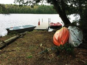 two boats are docked on the shore of a lake at Zazz - For precious moments with family or friends in Chertsey