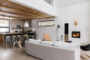 a living room with a couch and a table at Nomade A unique experience in the heart of nature in Grande Vallee +48 photos