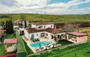 an aerial view of a house with a swimming pool at Villa Montona in Višnjan